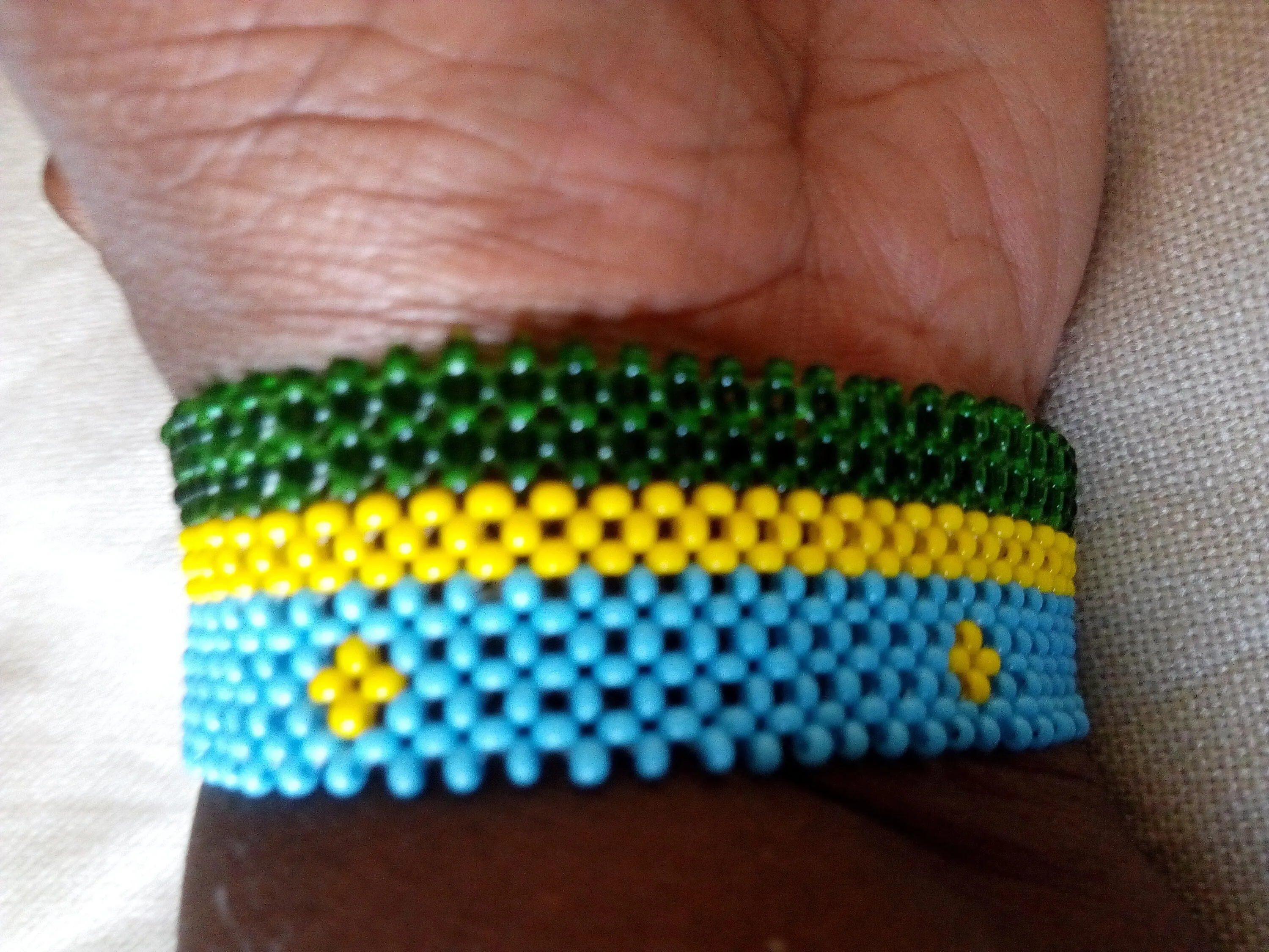 Rwanda flag beaded bracelet handmade from Kenya by the masaai/maasai community